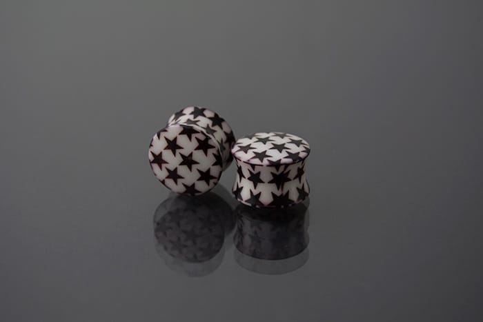 Dilatador acrílico blanco con estrellas