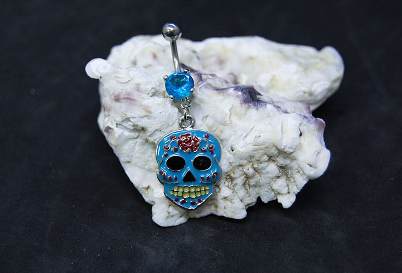 Navel acero calavera mexicana joyería azul