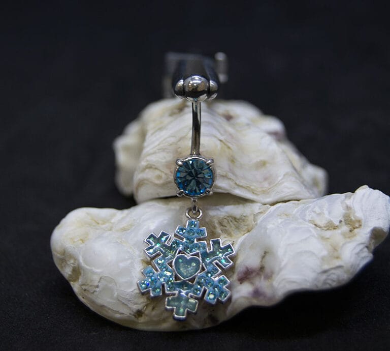 Navel acero formas azul joya