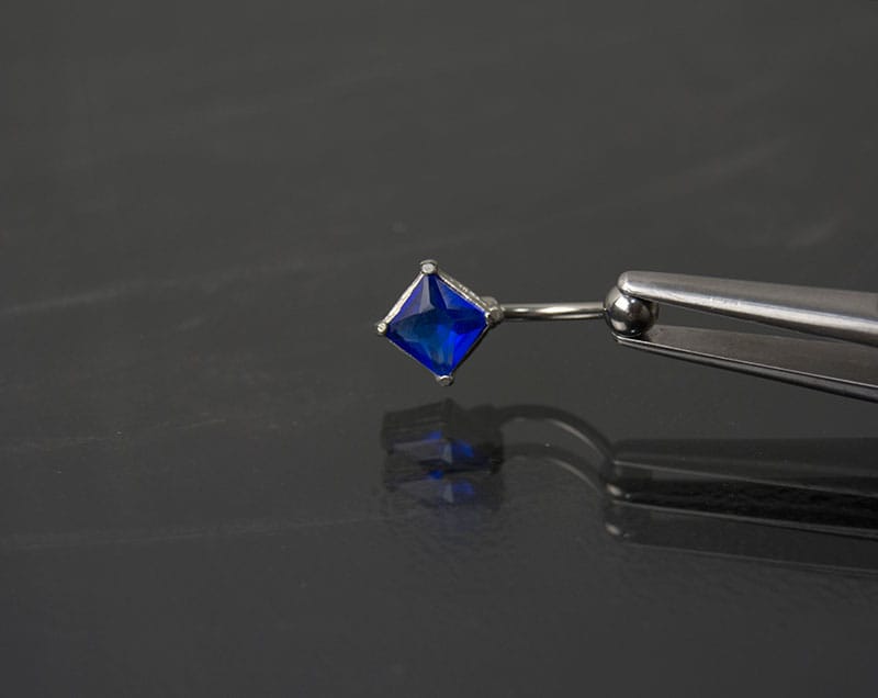 Navel acero joya azul