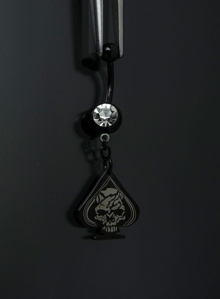 Navel acero negro joya blanco