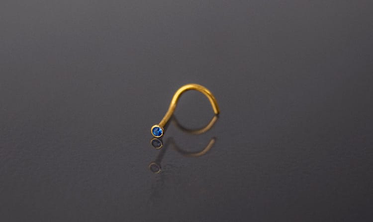 Piercing acero dorado con joyería